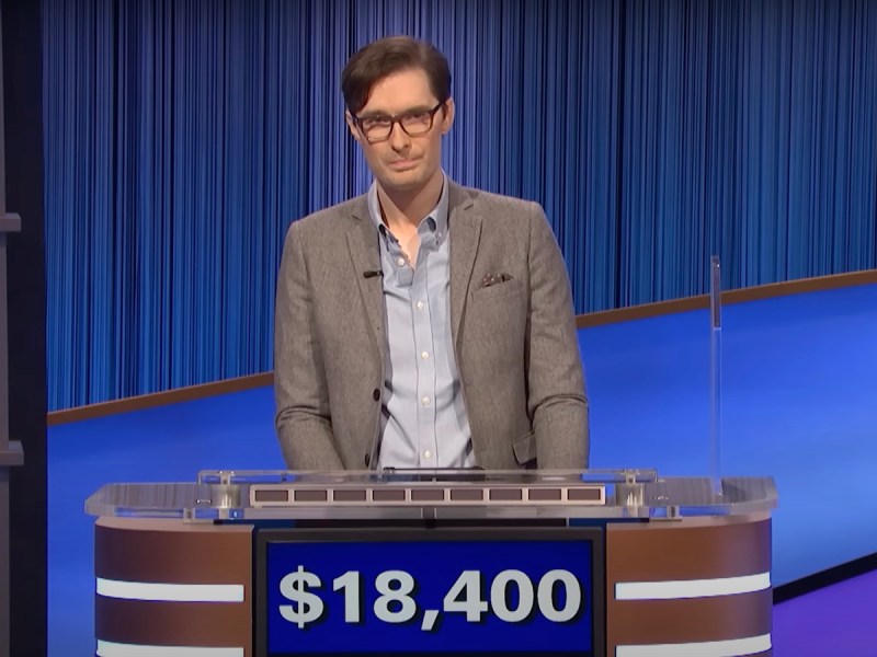 screenshot of Troy Meyer in a grey suit competing and winning during Final Jeopardy!