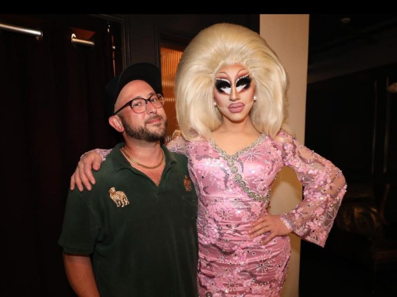 David Silver (L) and Trixie Mattel posing in dark room
