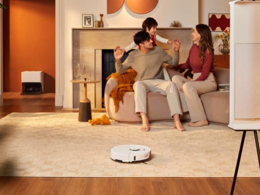 Roborock S8 Pro Ultra white in a living room with family.
