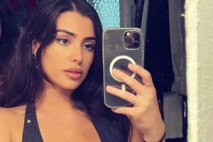 Bianca Censori Steps Out Seemingly Topless Under See-Through Raincoat