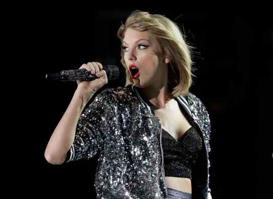 Taylor Swift Wears Chiefs Gear, 'TNT' Bracelet Gifted to Her by Travis Kelce Amid Eras Tour