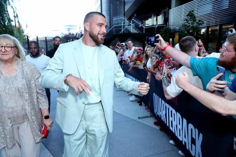 Travis Kelce Chugs Beer Behind Shirtless Jason Kelce Cutout Amid Chiefs' Victory Parade