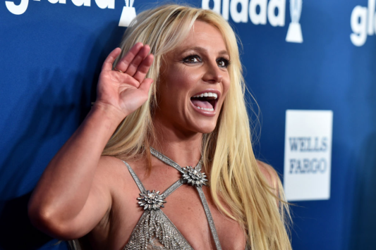 britney-spears-nearly-flashes-camera-while-pulling-on-bikini-in-beachy-video