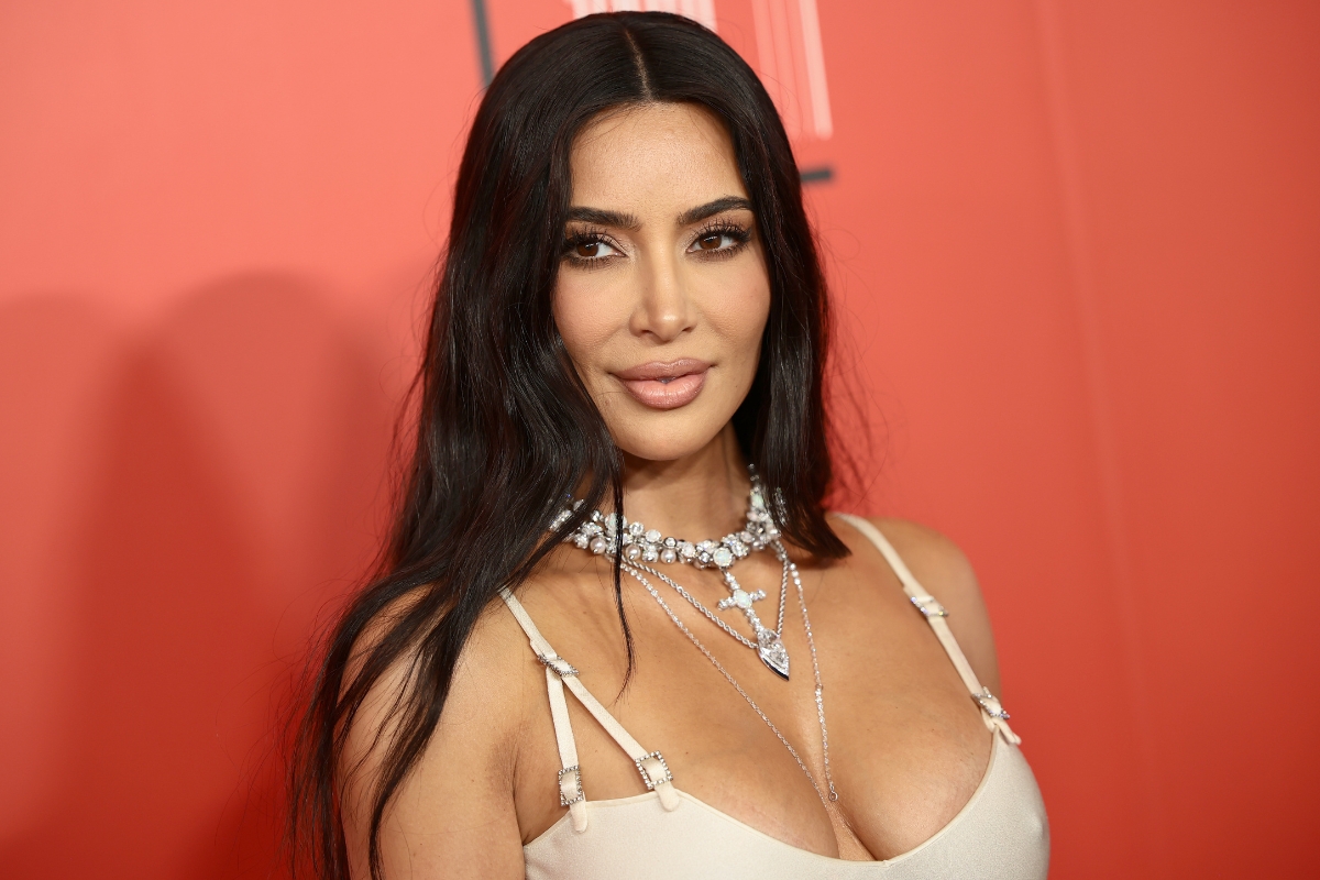 kim-kardashian-flaunts-beach-body-in-tiny-snake-print-swimsuits