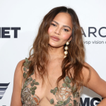chrissy-teigen-returns-to-si-swimsuit-in-barely-there-once-piece-10-years-after-last-cover-shoot
