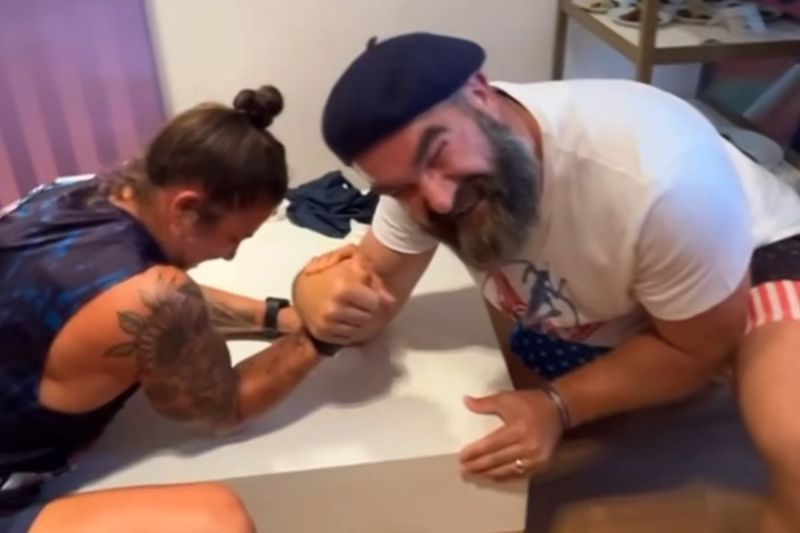 jason-kelce-arm-wrestles-team-usa-rugby-star-nicole-heavirland-at-olympics