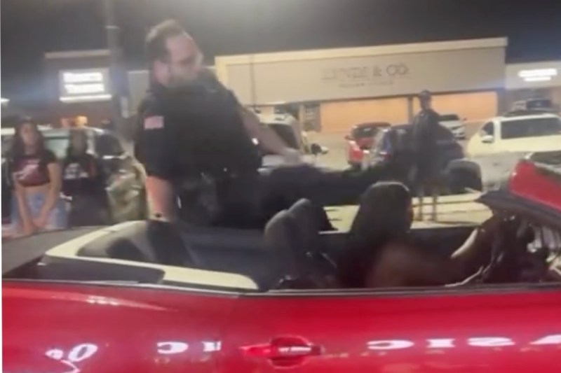 cop-flung-from-moving-car-while-trying-to-arrest-fleeing-suspect-in-shocking-video