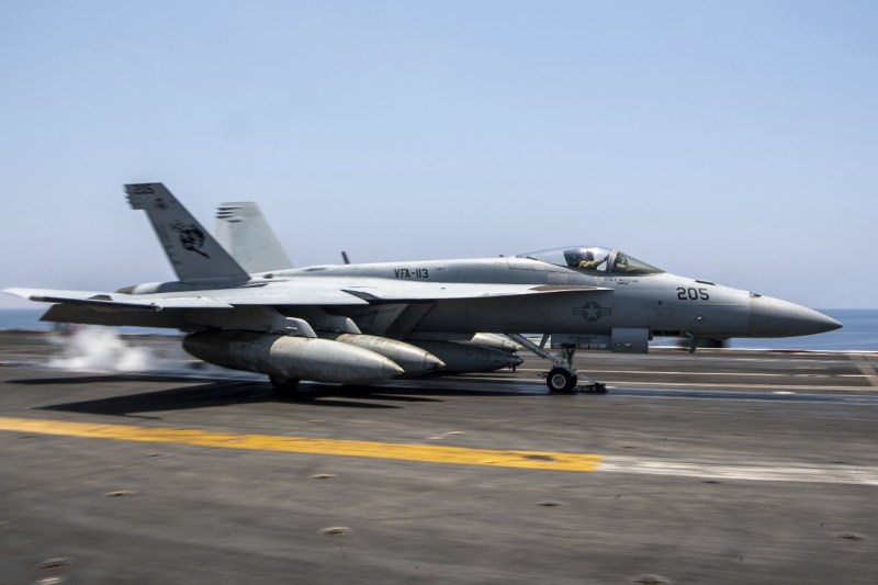 1-injured-after-us-fighter-jet-rolls-off-of-aircraft-carrier