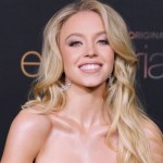 sydney-sweeney-takes-a-ride-in-white-skirt-and-strapless-top