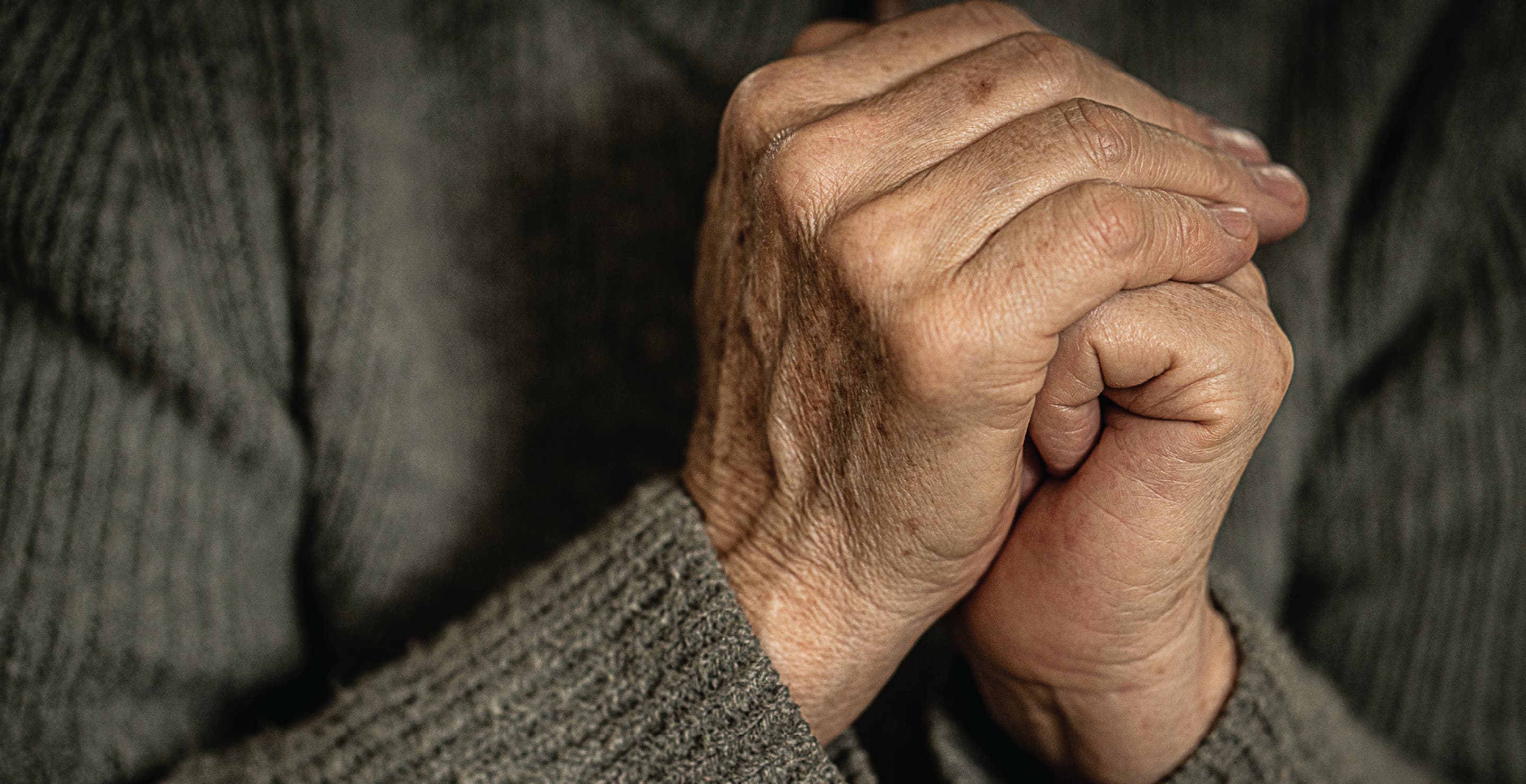 Elderly Woman Hands Clasped