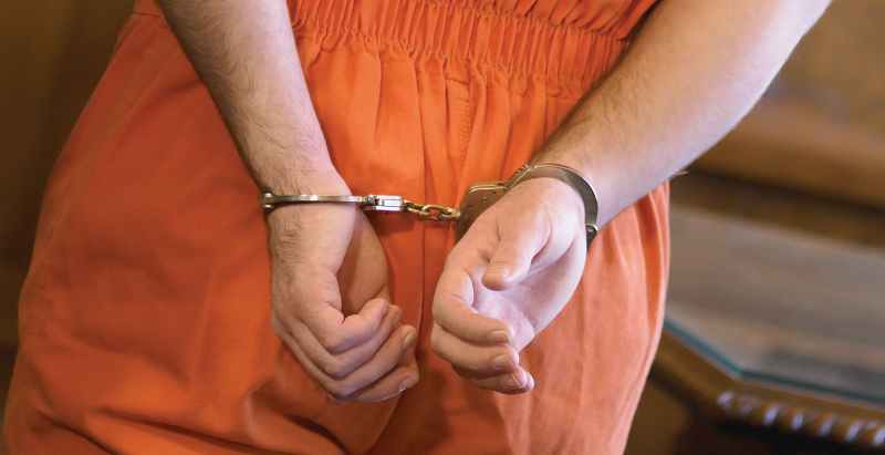 Handcuffed Defendant In Court