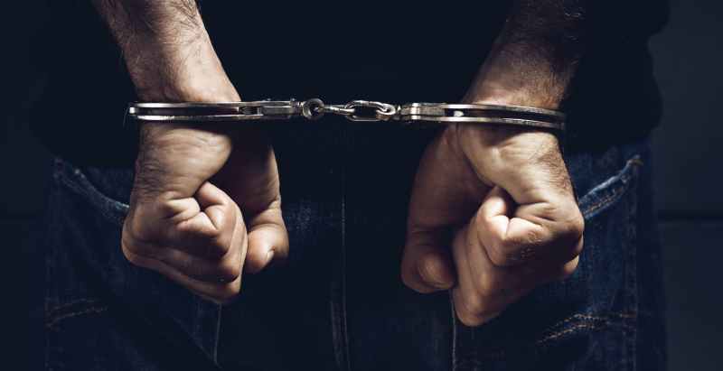 Arrested Man In Handcuffs