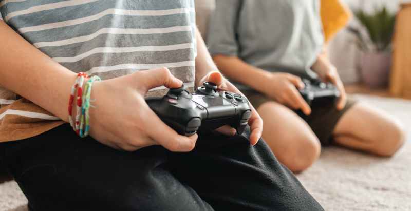 Children Playing With PlayStation Controllers