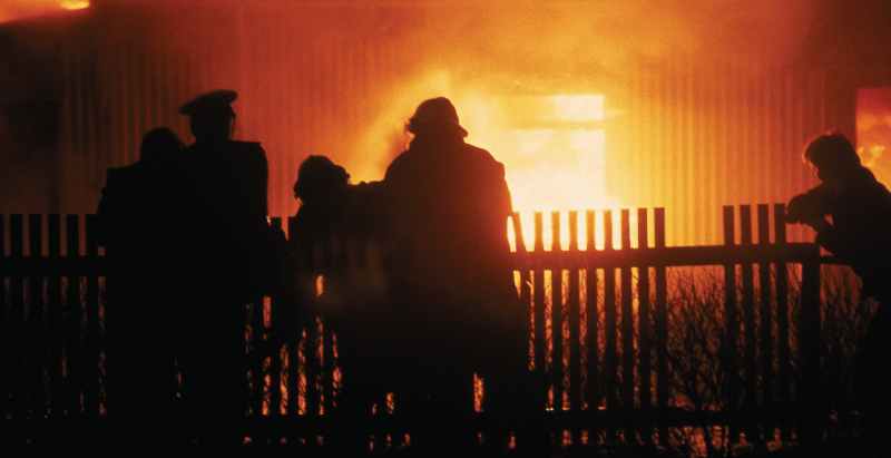 Firefighters Extinguishing House Fire