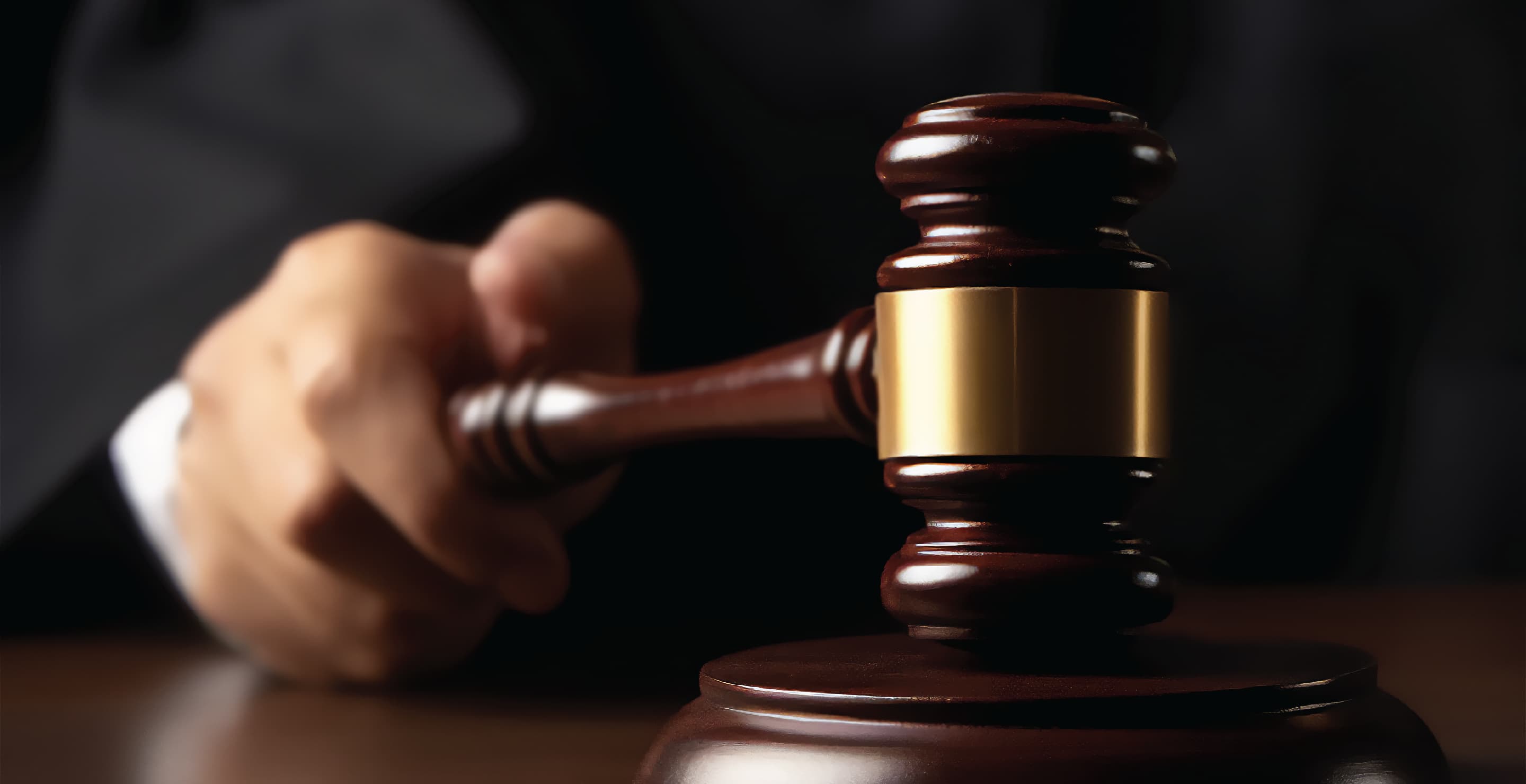 Judge Holding Gavel In Courtroom