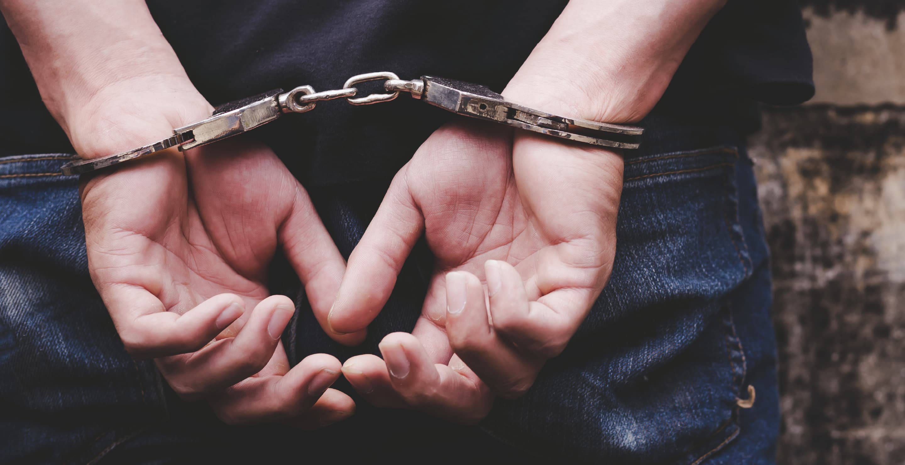 Man In Handcuffs, Hands On Back