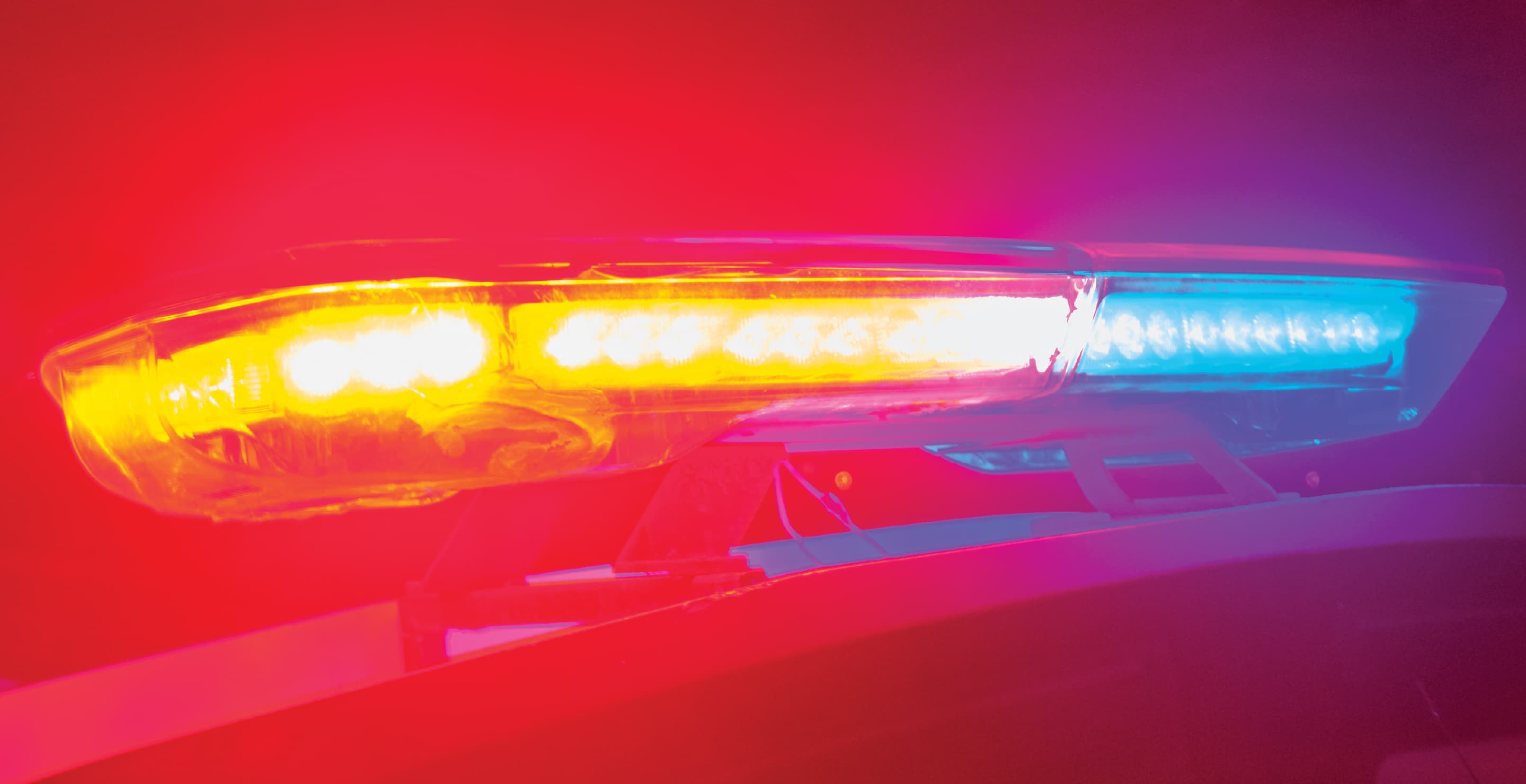 Police Car Flashing Lights At Night