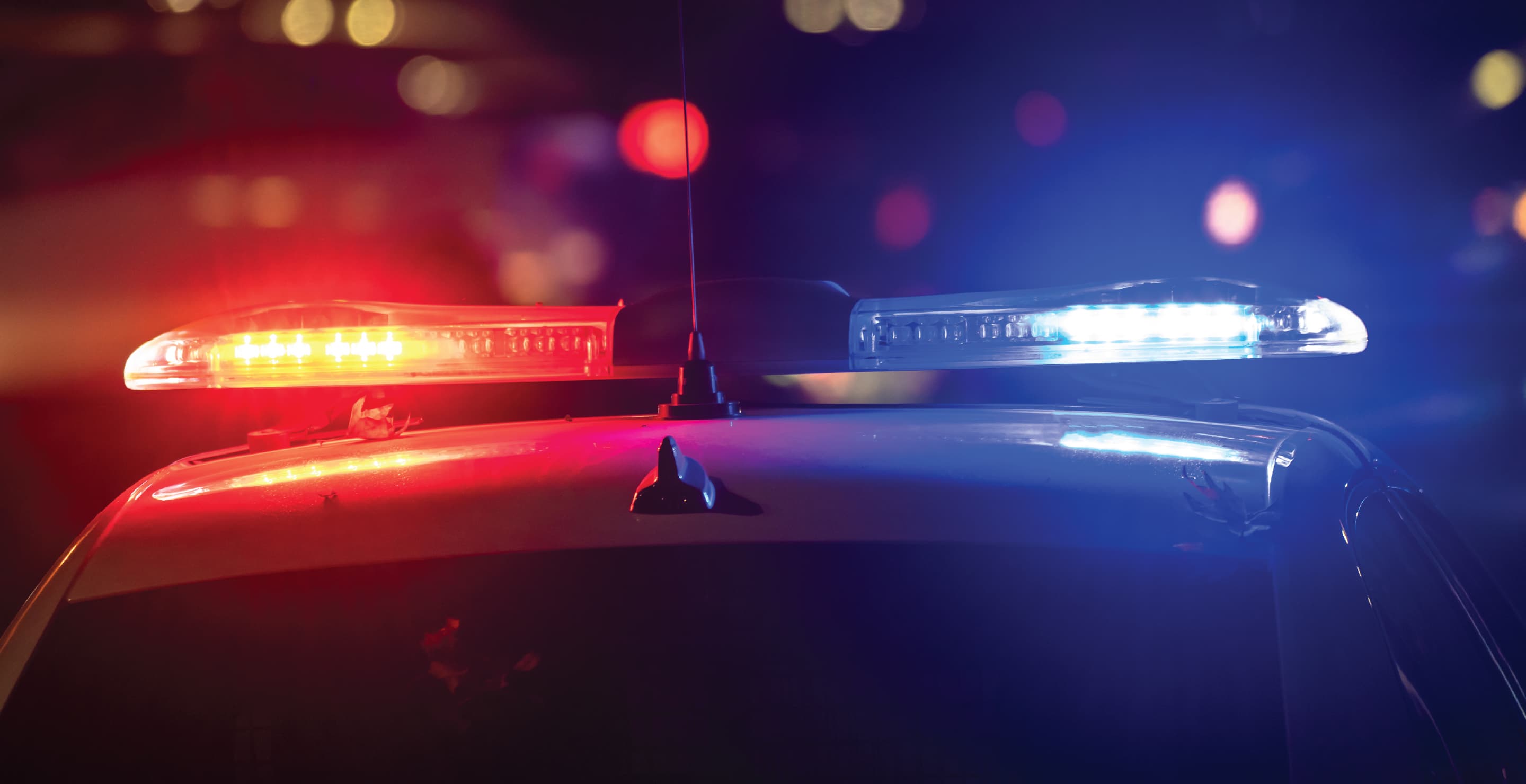 Police Car With Flashing Lights On