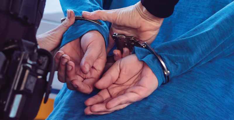 Police Officer Arresting Man