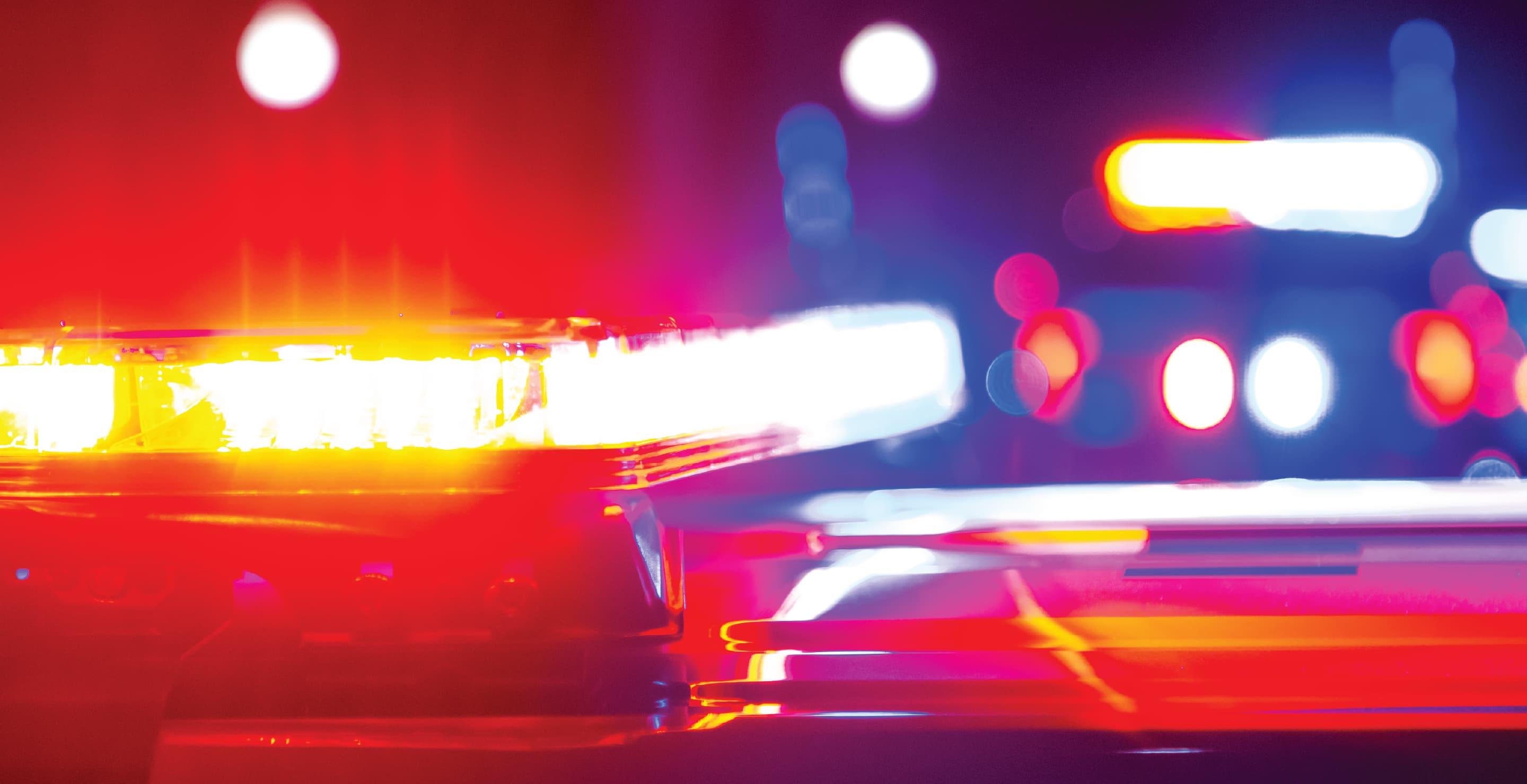 Police Patrol Vehicles At Night, Flashing Lights