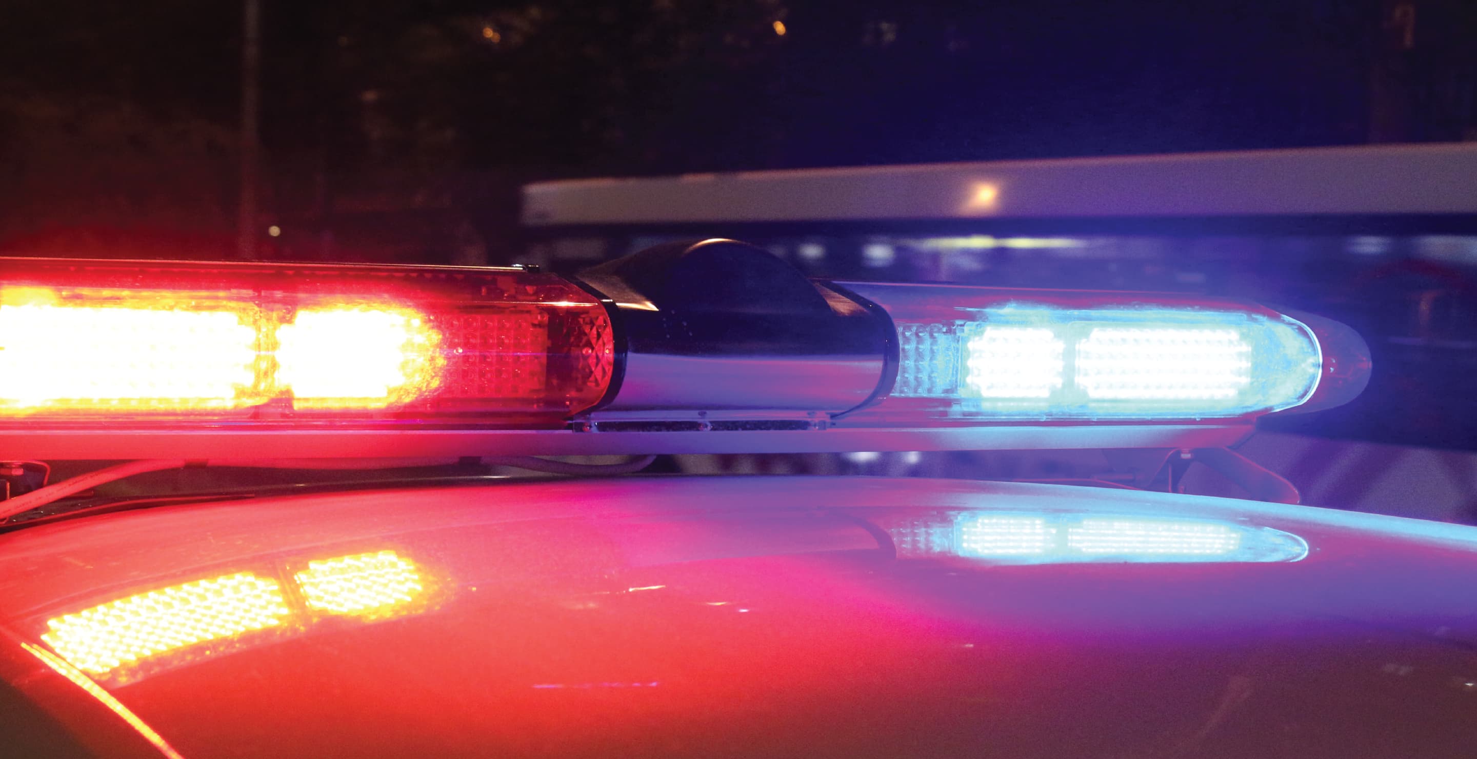 Police Red And Blue Flashing Lights At Night