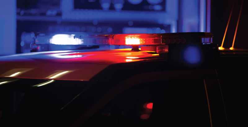 Police Unit Flashing Lights At Crime Scene