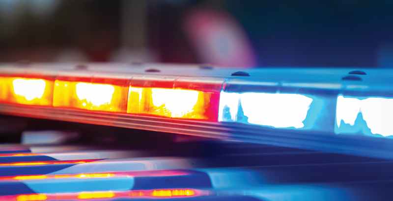 Police Vehicle Flashing Lights At Crime Scene