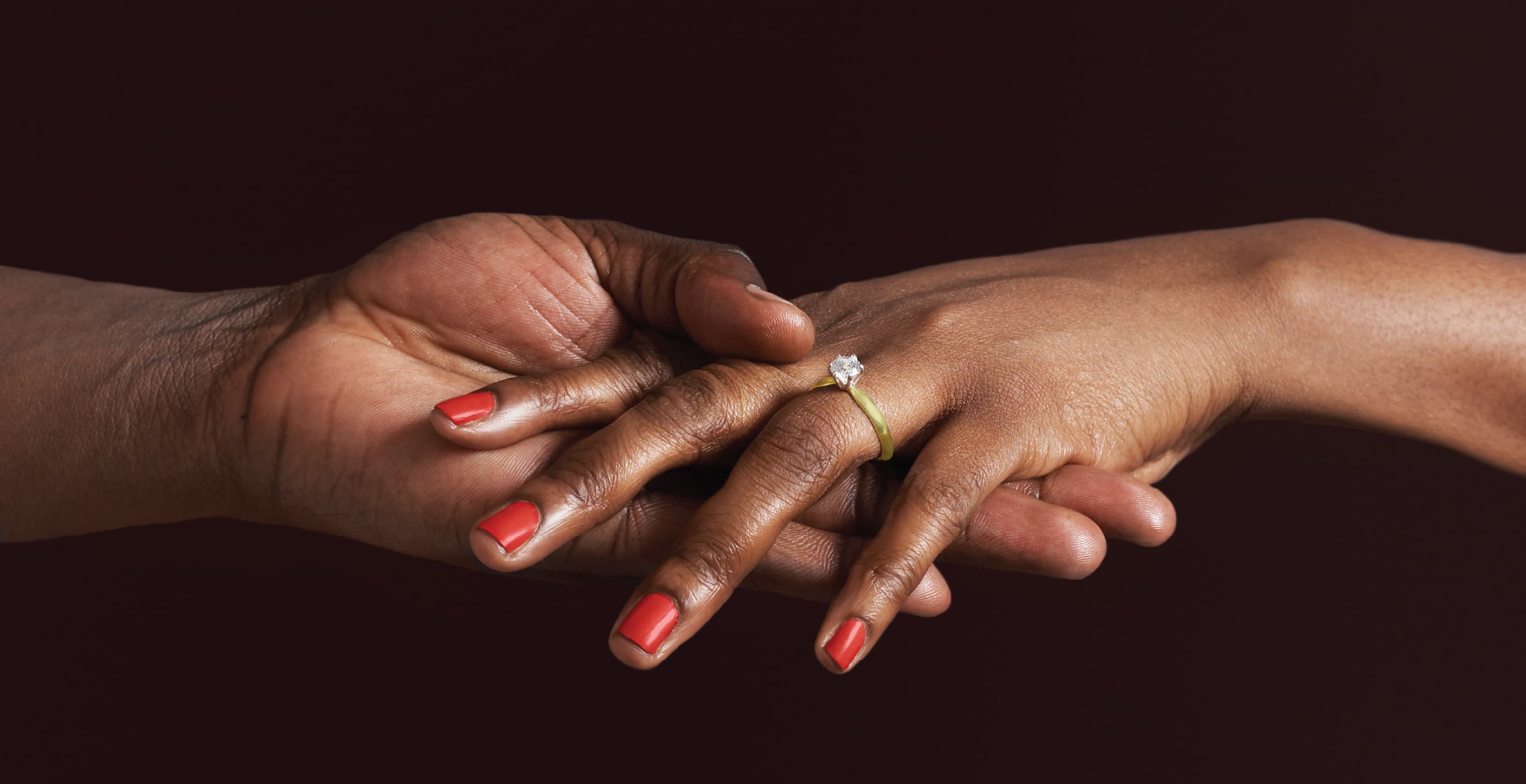 Woman With Engagement Ring Holding Hands