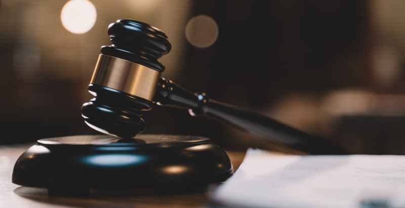 Wooden Judge Gavel On Desk