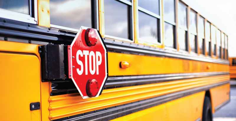 Yellow School Bus With Red Stop Sign