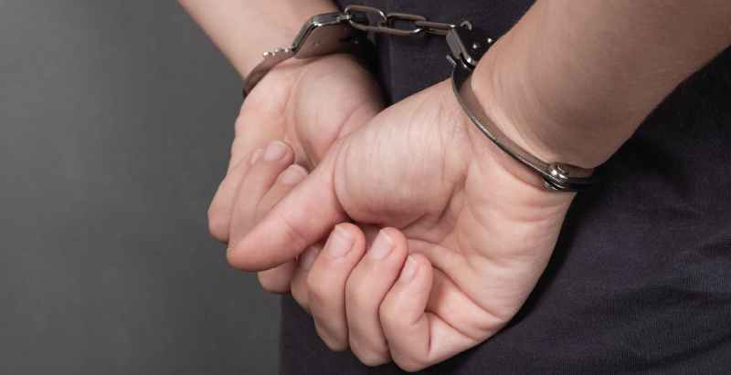 Arrested Person In Handcuffs