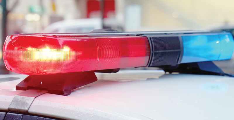 Blue And Red Lights On Top Of Police Car