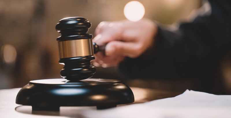 Judge Holding Wooden Gavel