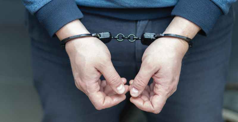 Man Arrested, Handcuffed