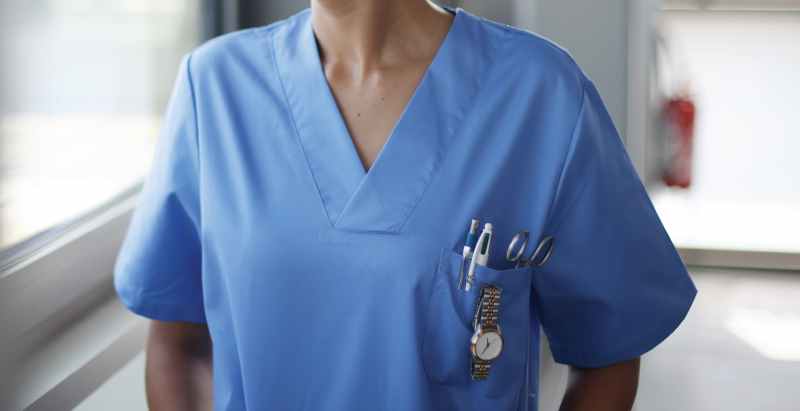Nurse In Hospital Corridor