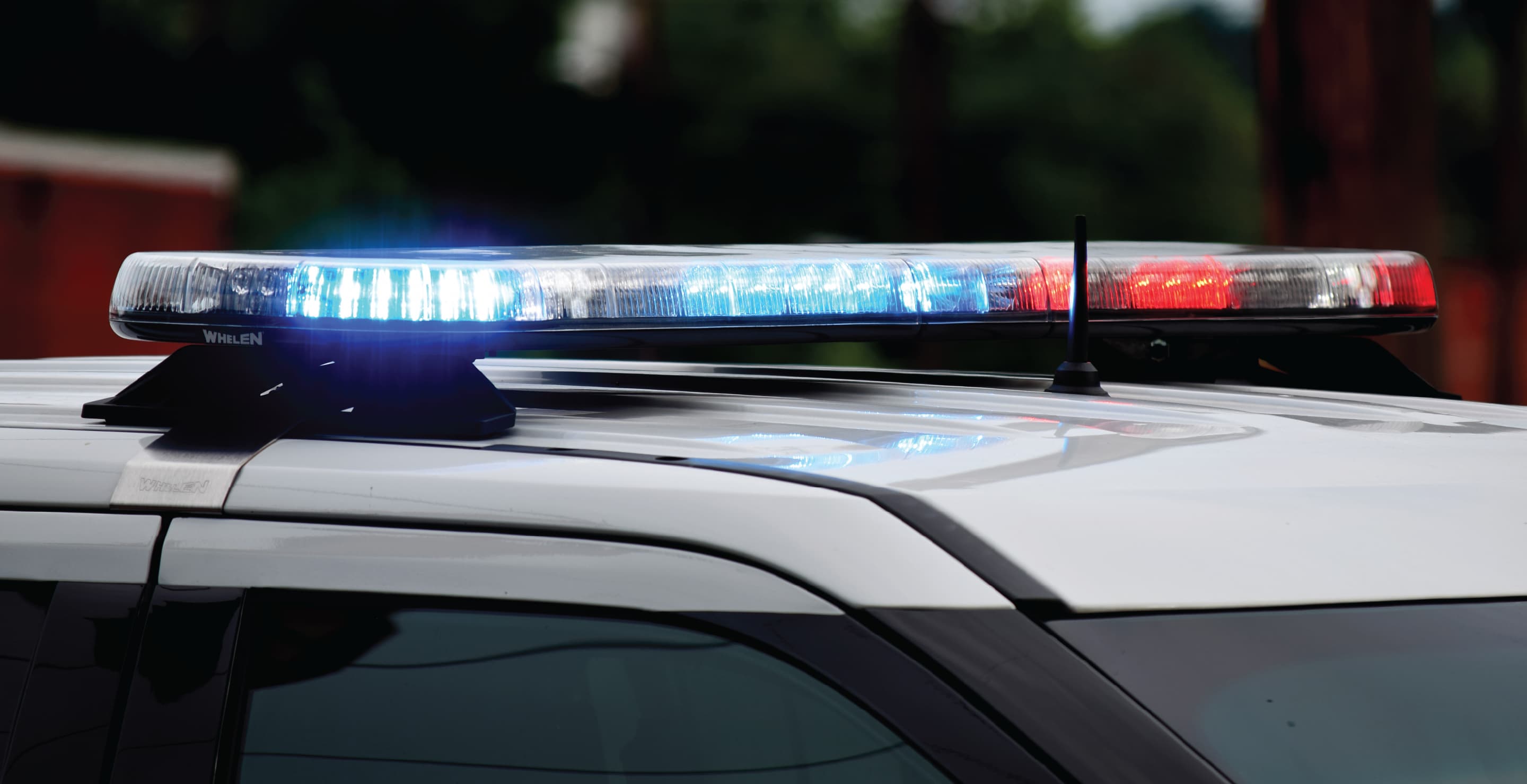 Police Car Flashing Lights During Day