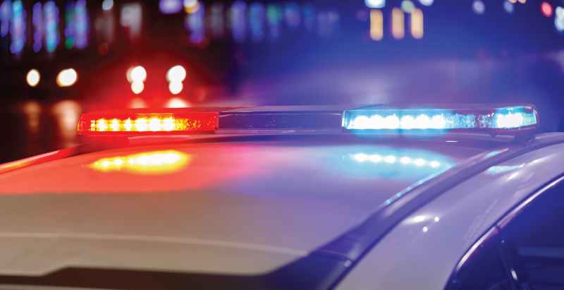 Police Car Lights At Night In City