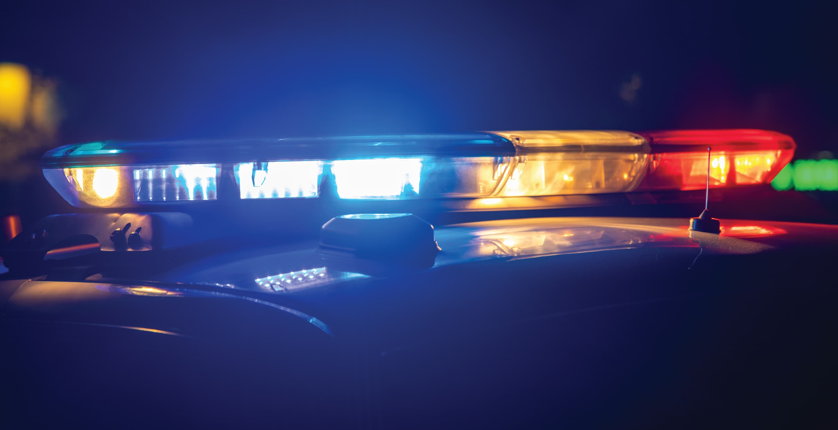 Red, Blue, And White Light Bar On Police Car