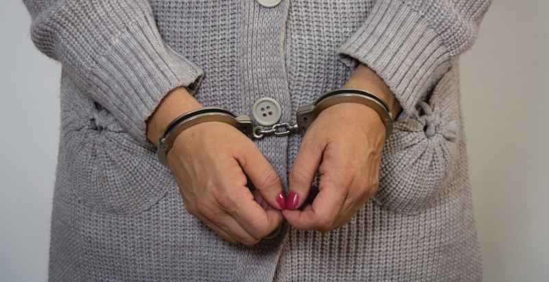 Woman Arrested, In Handcuffs