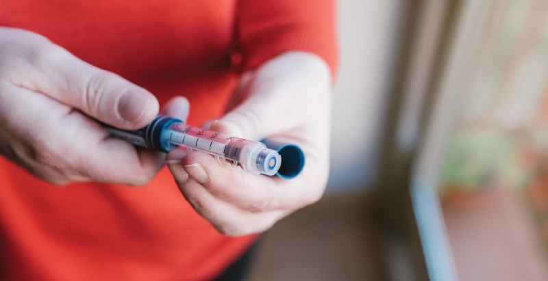 Woman With Insulin Syringe