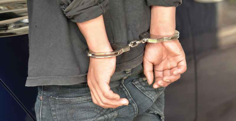 Young Man Arrested, In Handcuffs